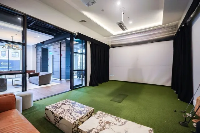 a living room with furniture and a rug