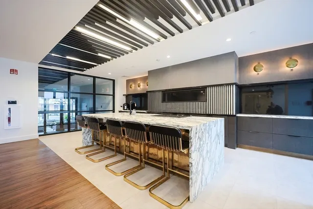 a view of kitchen and wooden floor