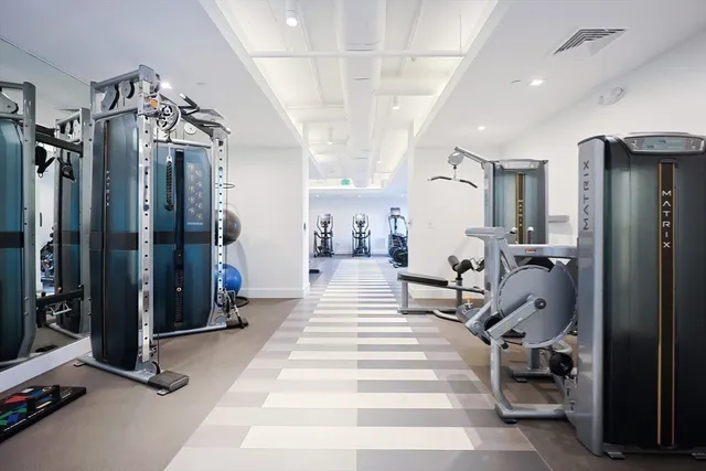 a very nice looking room with a mirror and furniture