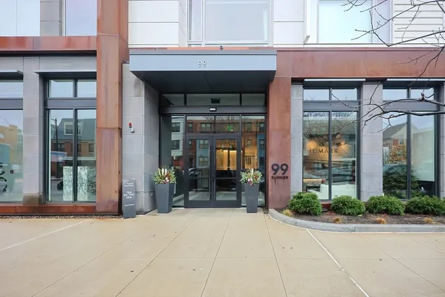 a view of a building with potted plants