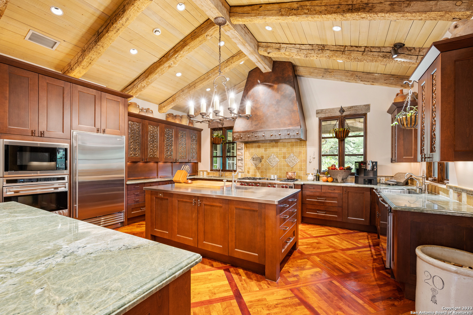 124 Highway 46 Boerne, TX 78006 - Photo 9 of 32 a kitchen with stainless steel appliances granite countertop a sink a stove and a refrigerator