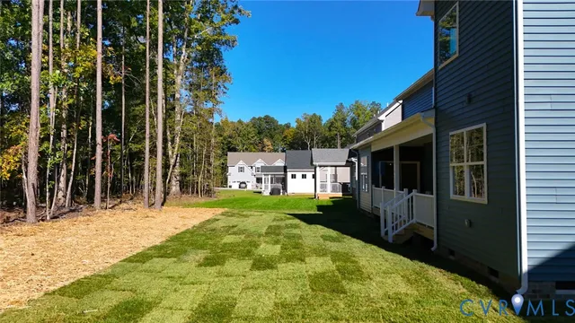 a view of a house with a backyard