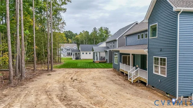 a view of a patio with a table and chairs under an umbrella