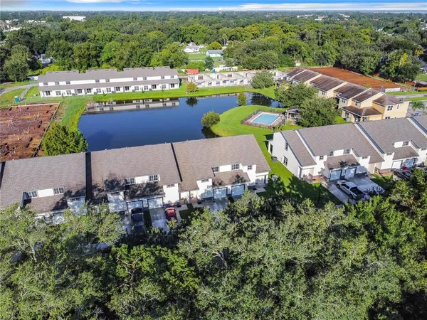 an aerial view of a house with a swimming pool yard and outdoor seating
