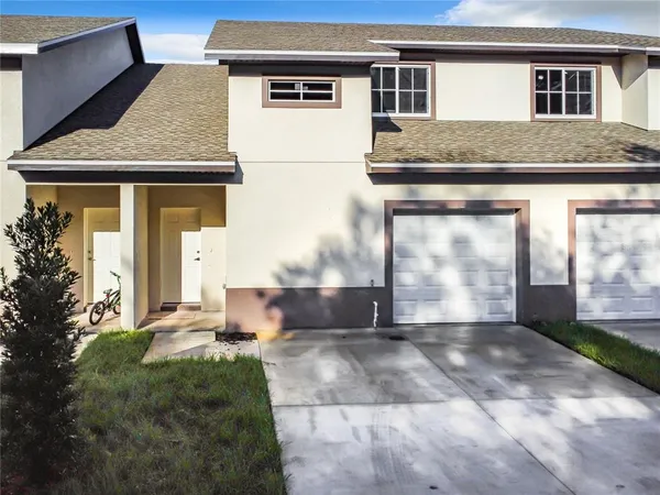 a kitchen with stainless steel appliances granite countertop a sink and dishwasher a stove top oven with white cabinets