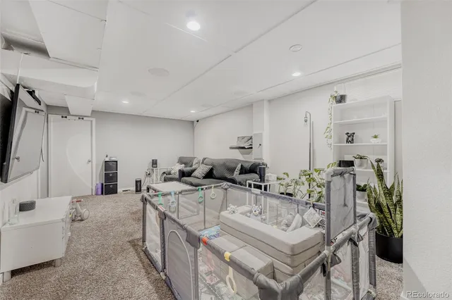 a very nice looking living room with a large window