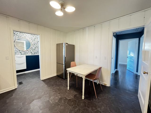 a view of a swimming pool with outdoor seating