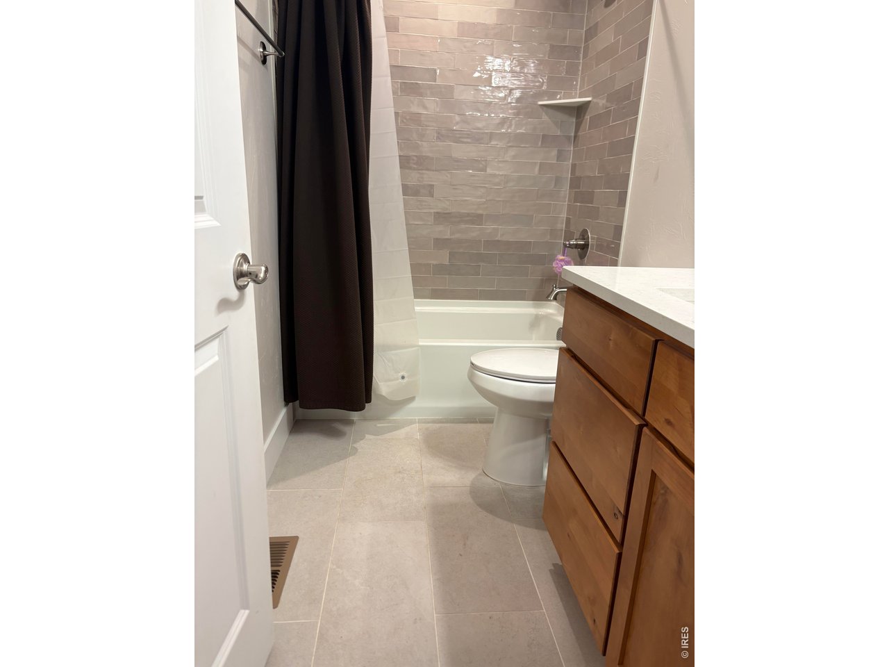 102 7th Avenue Wiggins, CO 80654 - Photo 12 of 17 a bathroom with a toilet and a shower