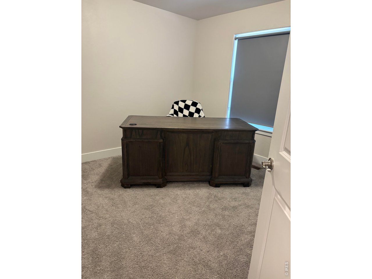102 7th Avenue Wiggins, CO 80654 - Photo 17 of 17 a room with cabinet