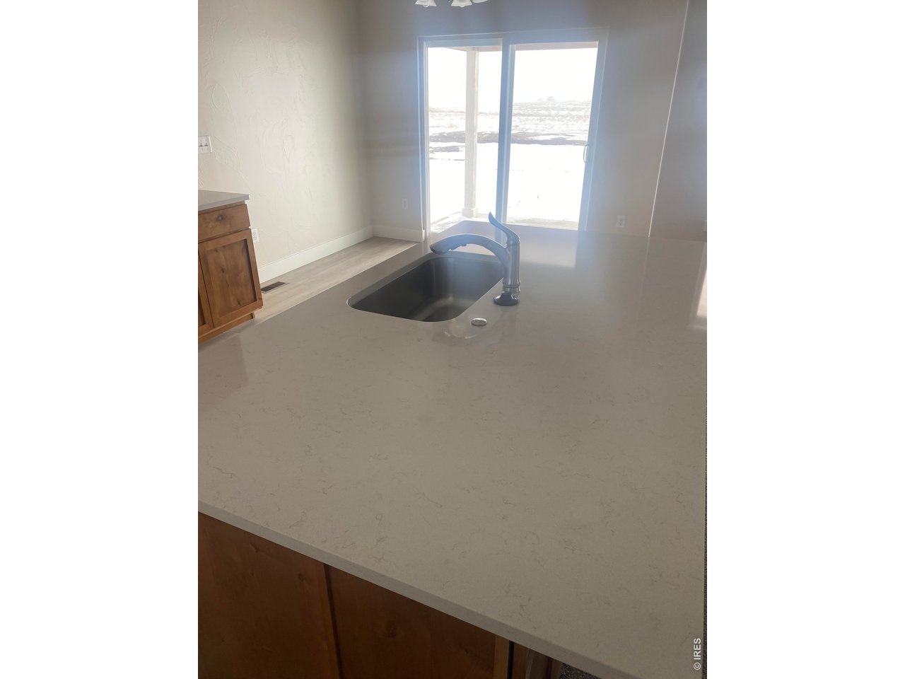 102 7th Avenue Wiggins, CO 80654 - Photo 4 of 17 a room with a window and a table