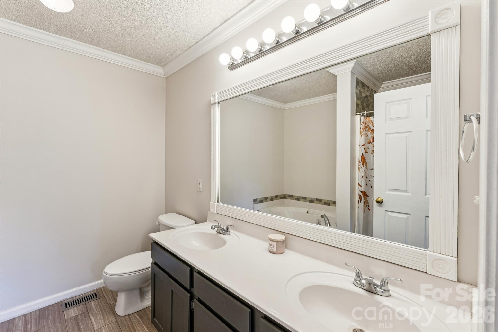 103 Quarry Way Salisbury, NC 28146 - Photo 25 of 47 a bathroom with a granite countertop sink toilet and mirror