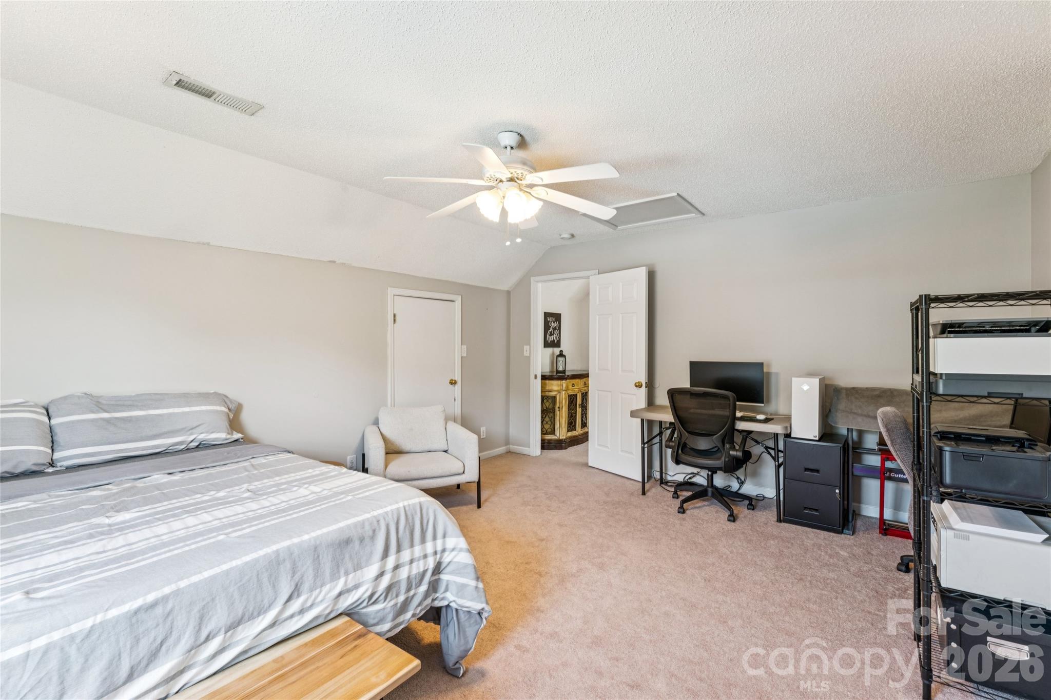 103 Quarry Way Salisbury, NC 28146 - Photo 33 of 47 a bedroom with a bed and a chandelier