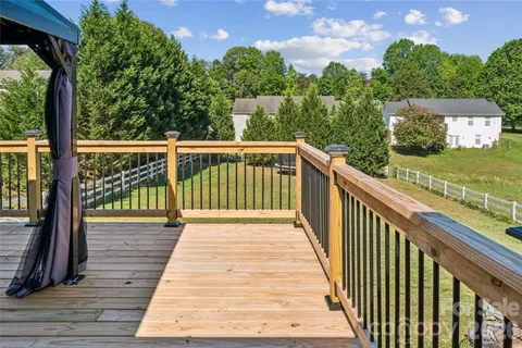a view of a balcony with wooden floor