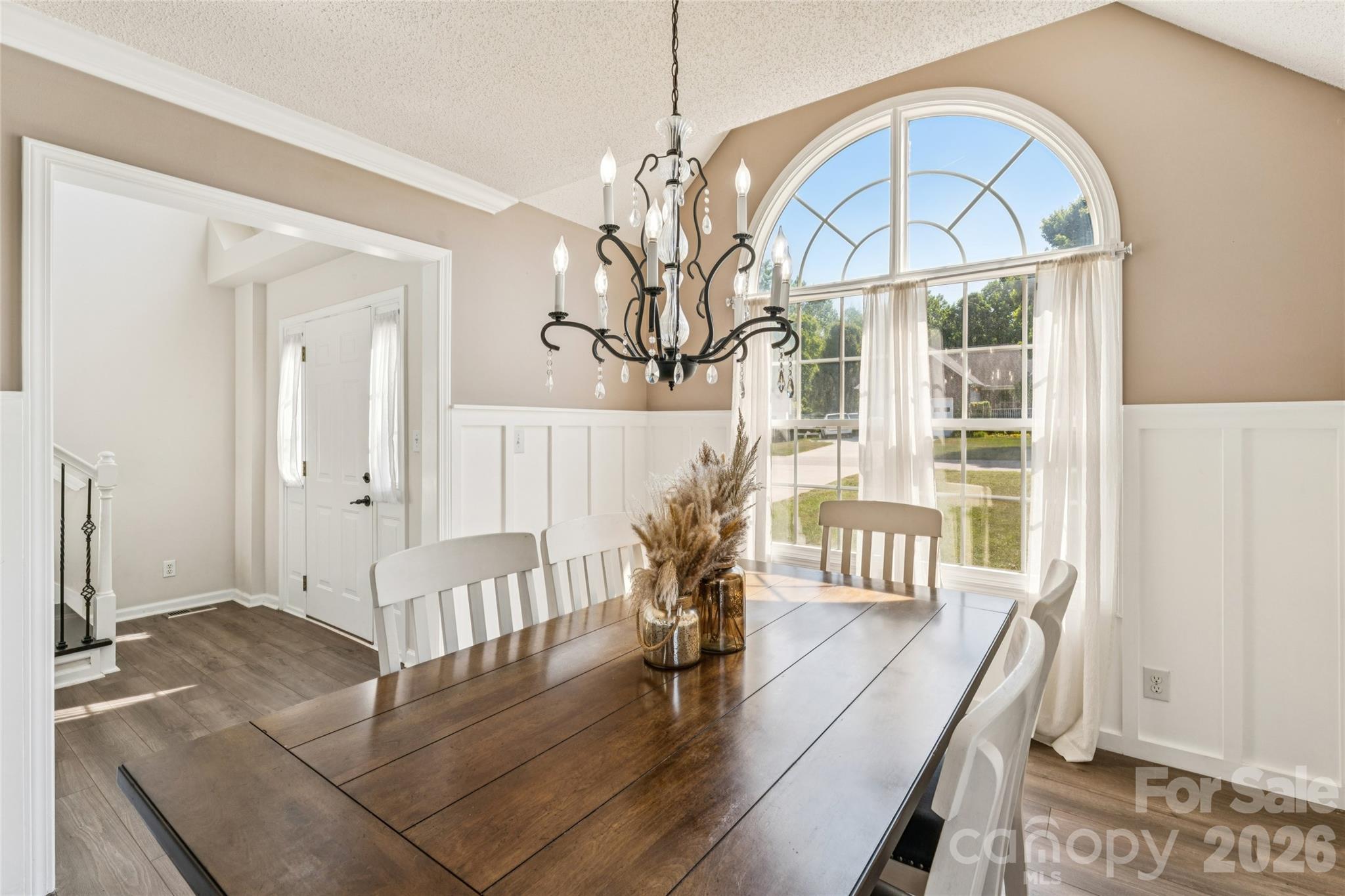 103 Quarry Way Salisbury, NC 28146 - Photo 8 of 47 a view of a dining room with furniture a chandelier and wooden floor