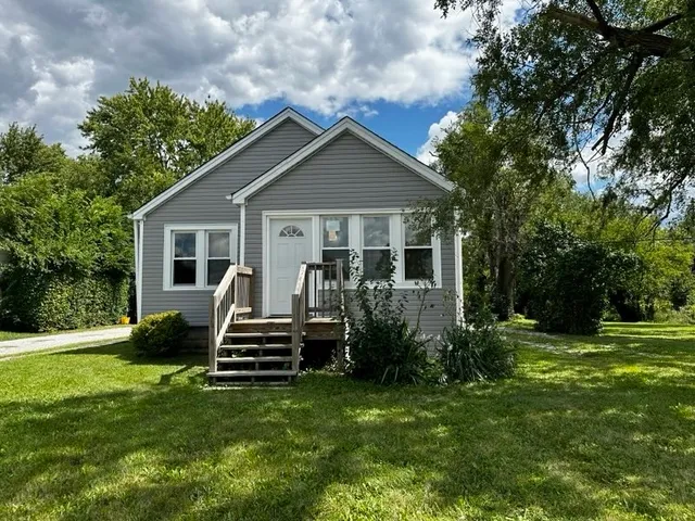 a view of a house with a back yard