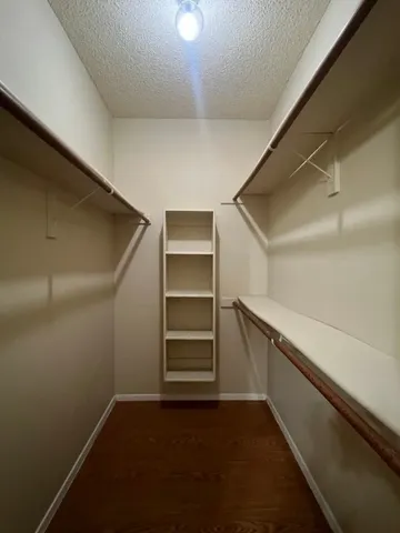 a view of an empty walk in closet