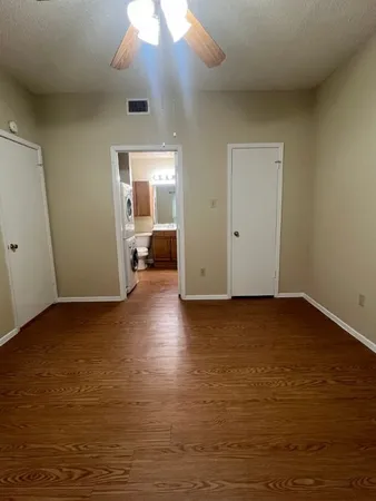 a view of a livingroom with wooden floor