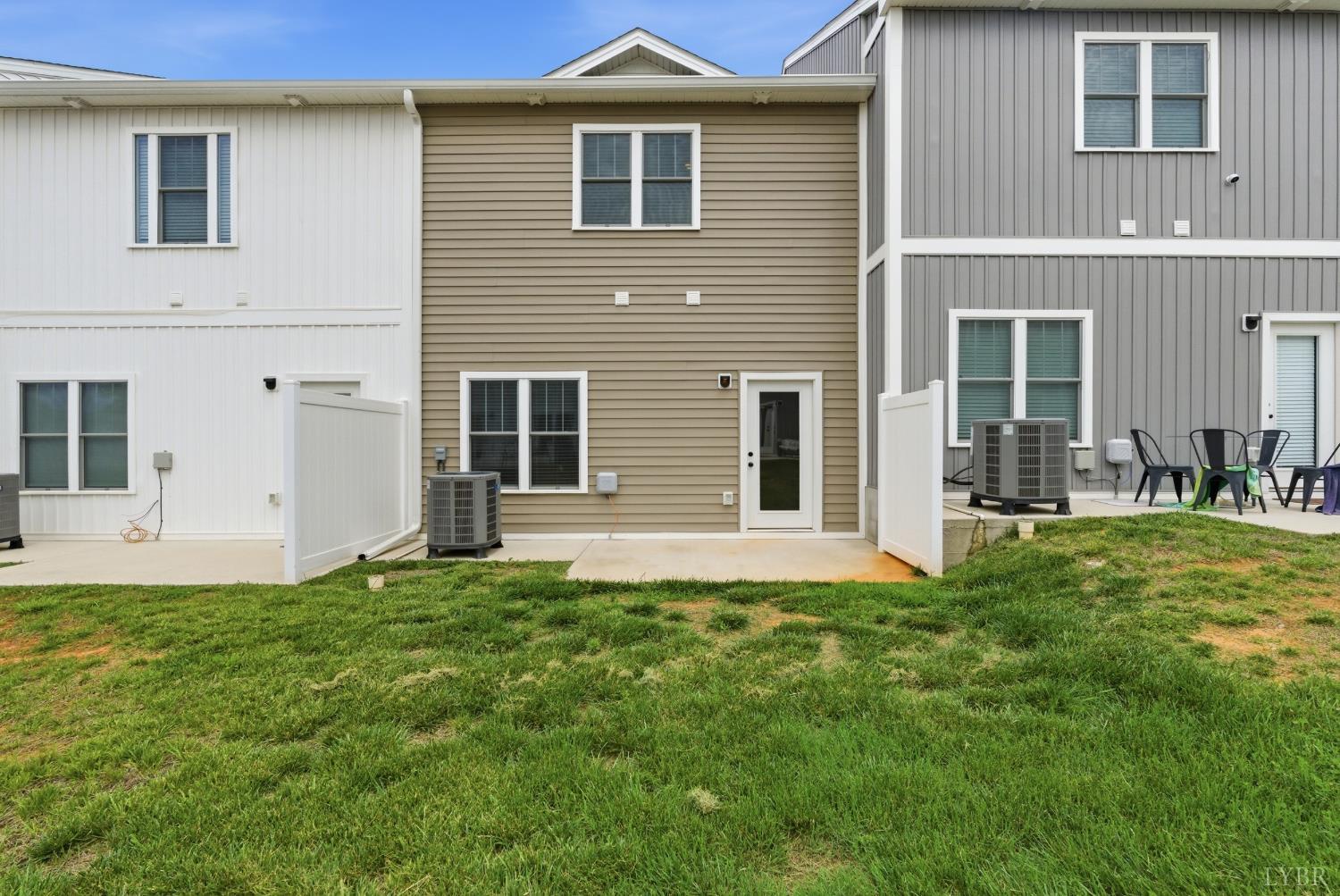 556 Leesville Road, Unit 406 Lynchburg, VA 24502 - Photo 34 of 39 a front view of a house with a yard
