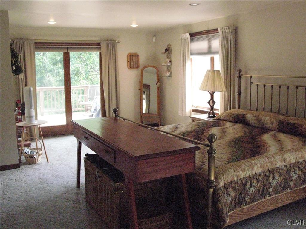 5955 Little Gap Road Kunkletown, PA 18058 - Photo 14 of 41 a bedroom with a bed and a table