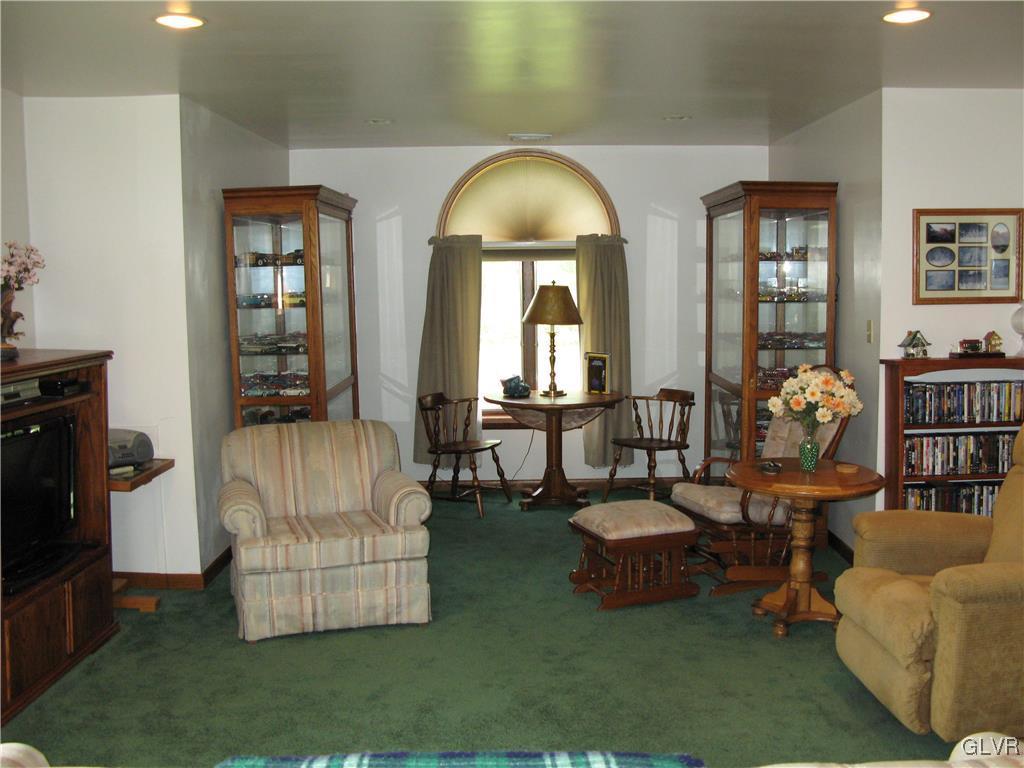 5955 Little Gap Road Kunkletown, PA 18058 - Photo 21 of 41 a living room with couches and a dining table with garden view