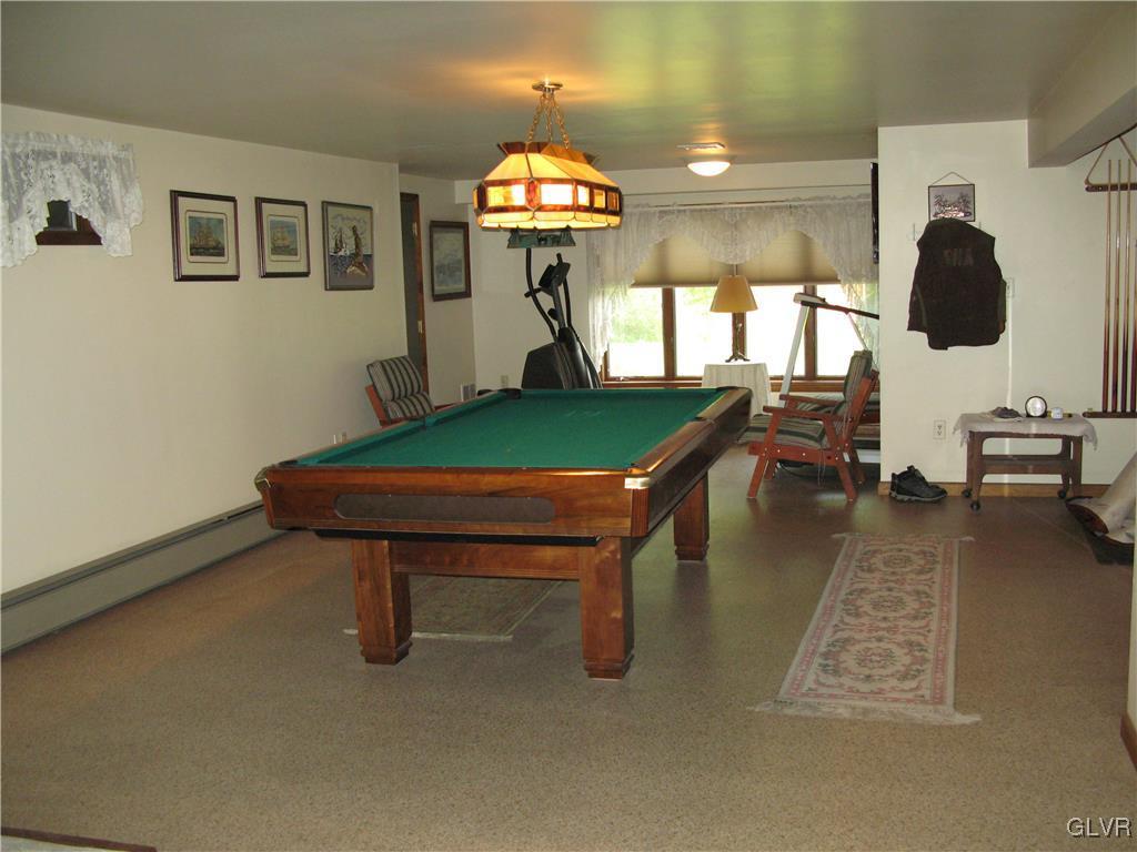 5955 Little Gap Road Kunkletown, PA 18058 - Photo 24 of 41 a room with lots of furniture and paintings on the wall