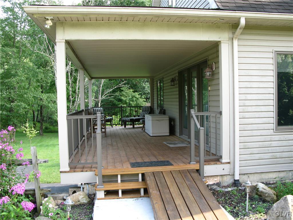 5955 Little Gap Road Kunkletown, PA 18058 - Photo 7 of 41 a porch with table and chairs