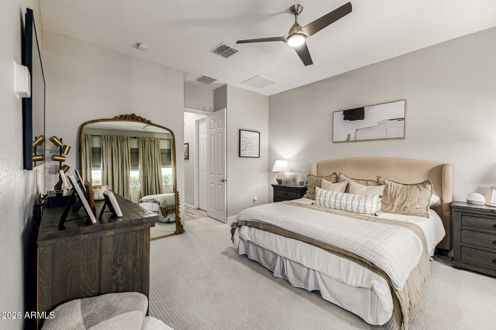 2941 South Jeffry Street Gilbert, AZ 85295 - Photo 14 of 47 a bedroom with a bed and a mirror