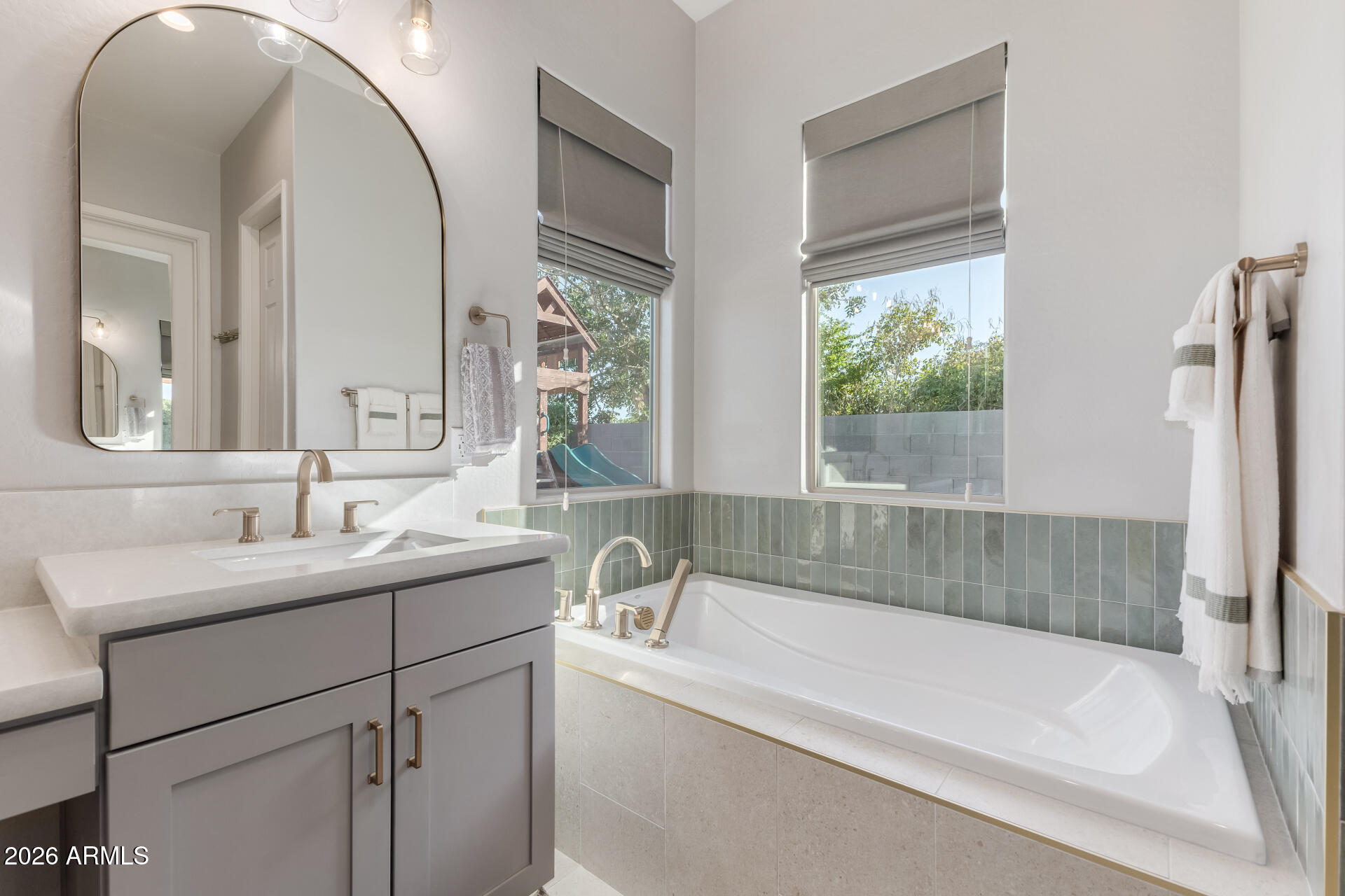 2941 South Jeffry Street Gilbert, AZ 85295 - Photo 16 of 47 a bathroom with a bathtub and a sink