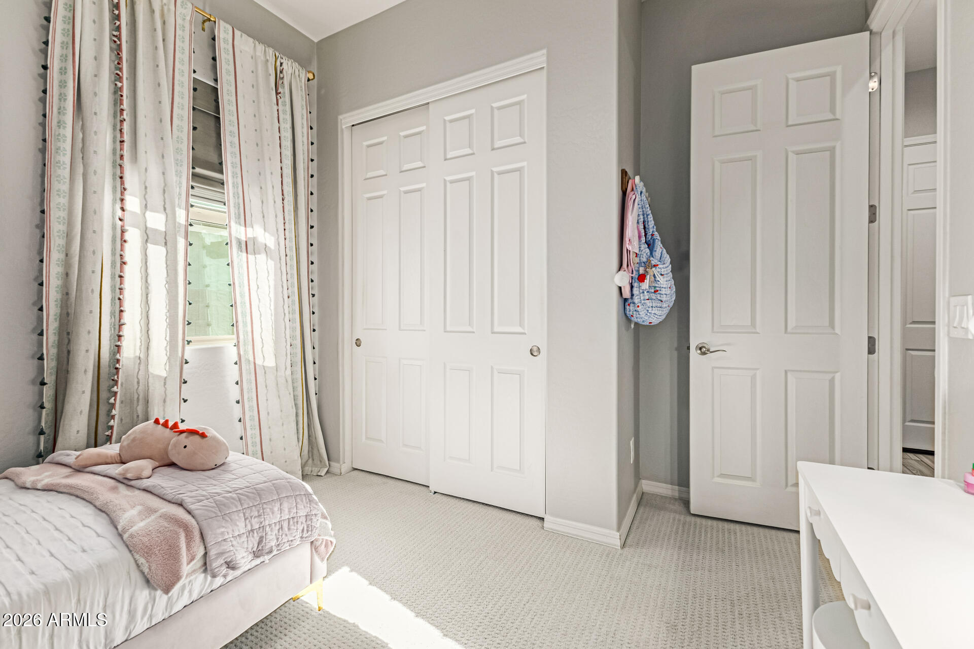 2941 South Jeffry Street Gilbert, AZ 85295 - Photo 23 of 47 a bedroom with a bed and a window