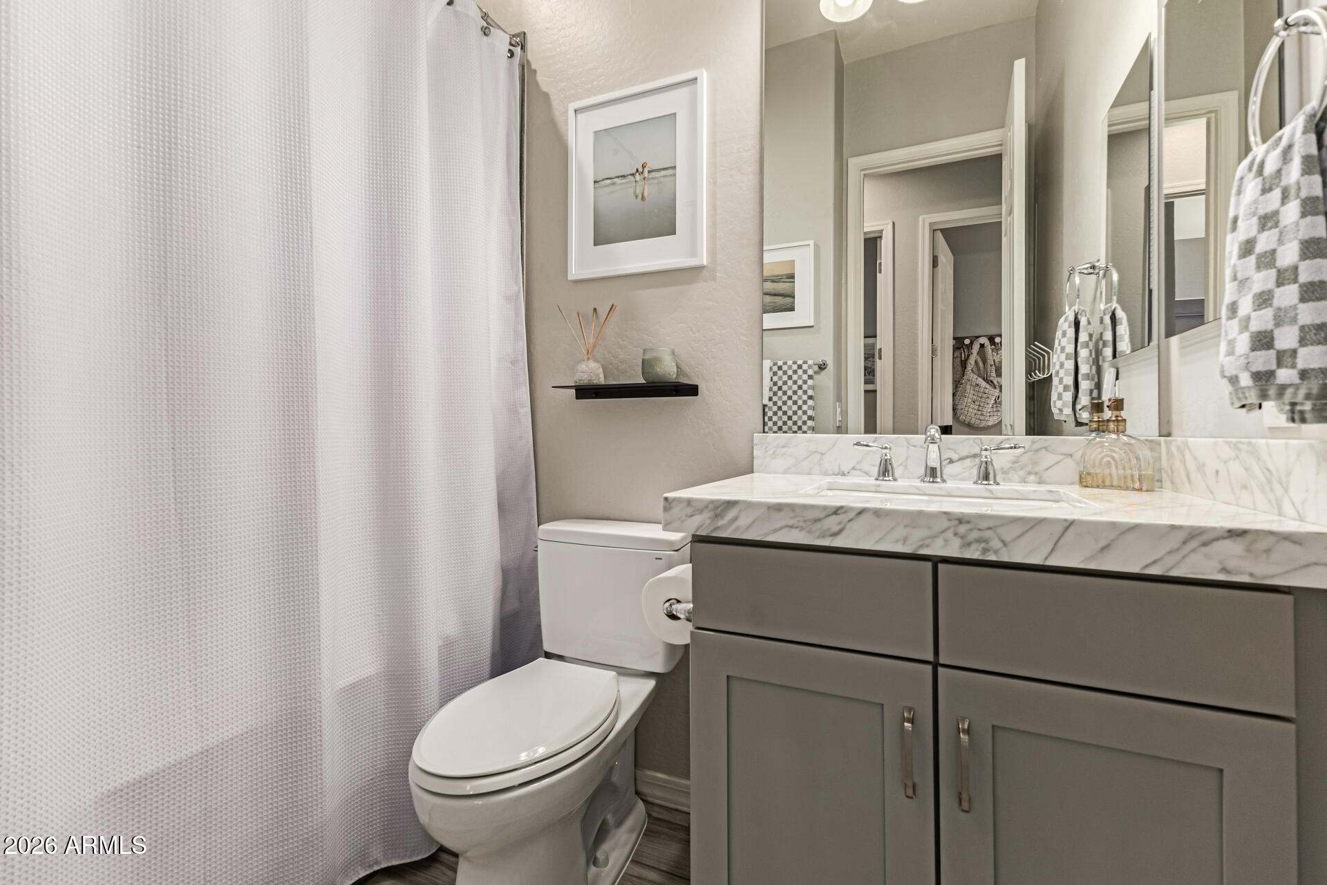 2941 South Jeffry Street Gilbert, AZ 85295 - Photo 26 of 47 a bathroom with a granite countertop sink toilet and mirror