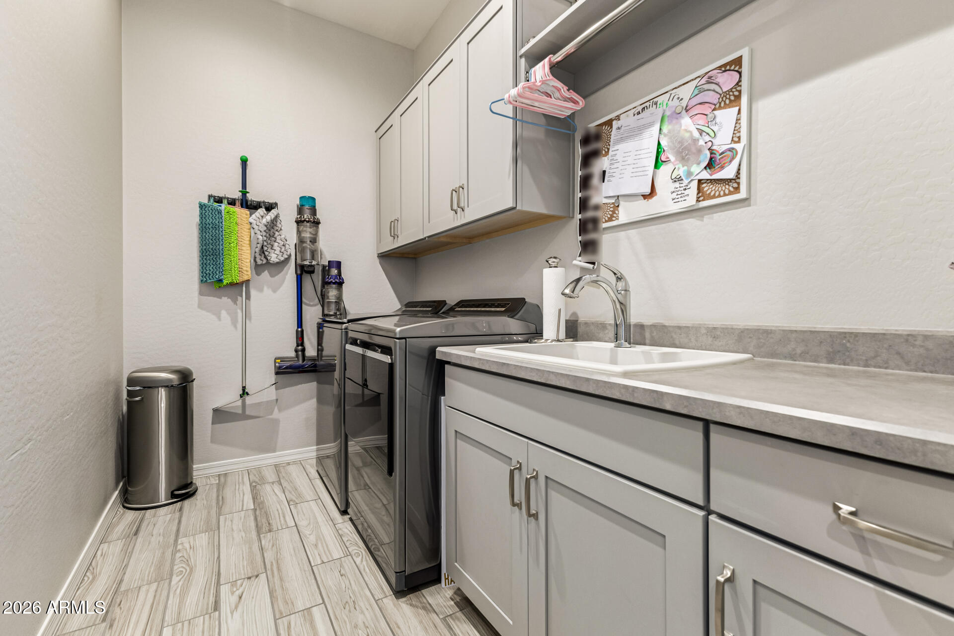 2941 South Jeffry Street Gilbert, AZ 85295 - Photo 29 of 47 a kitchen with a sink and cabinets
