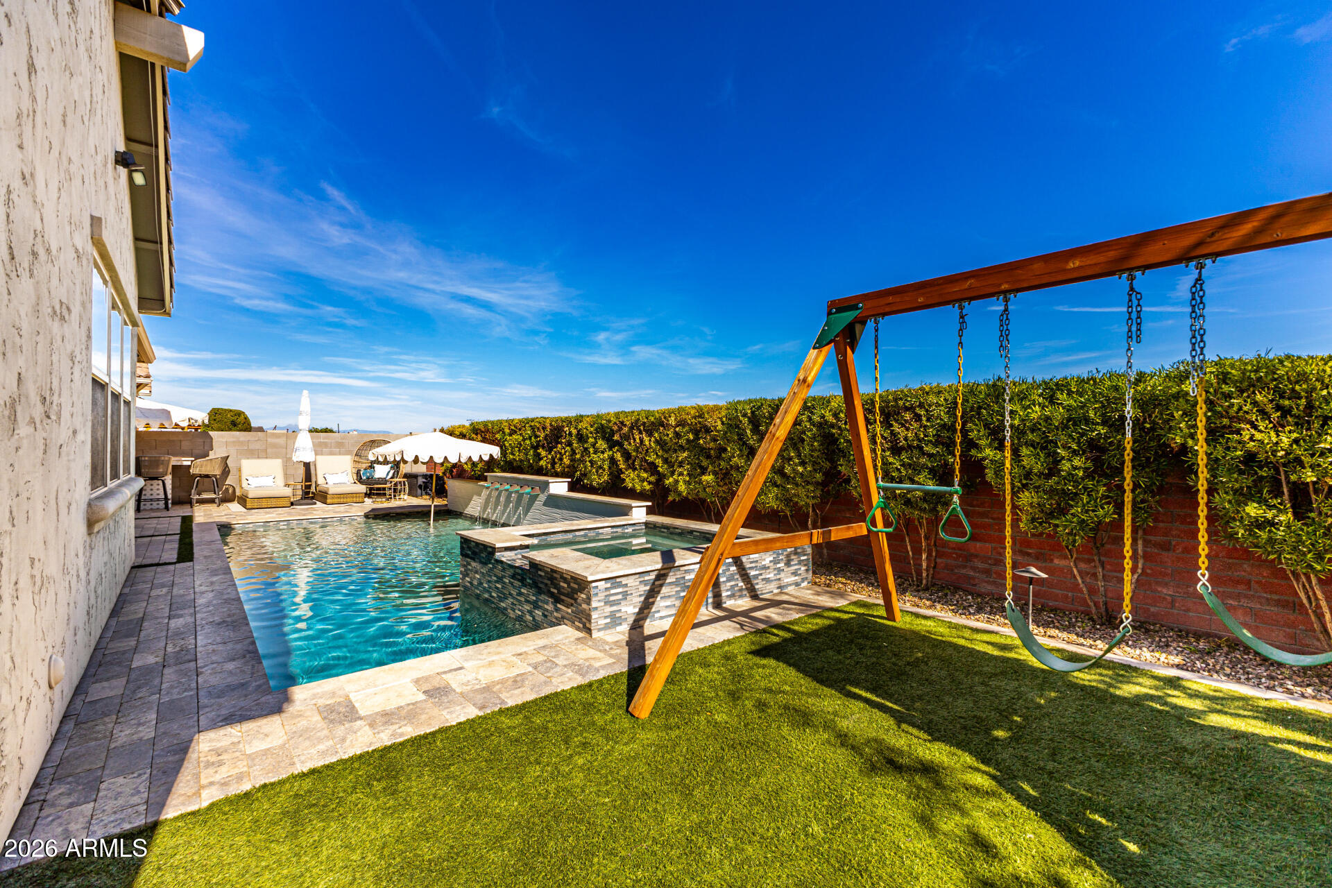 2941 South Jeffry Street Gilbert, AZ 85295 - Photo 35 of 47 a view of a swimming pool with a patio