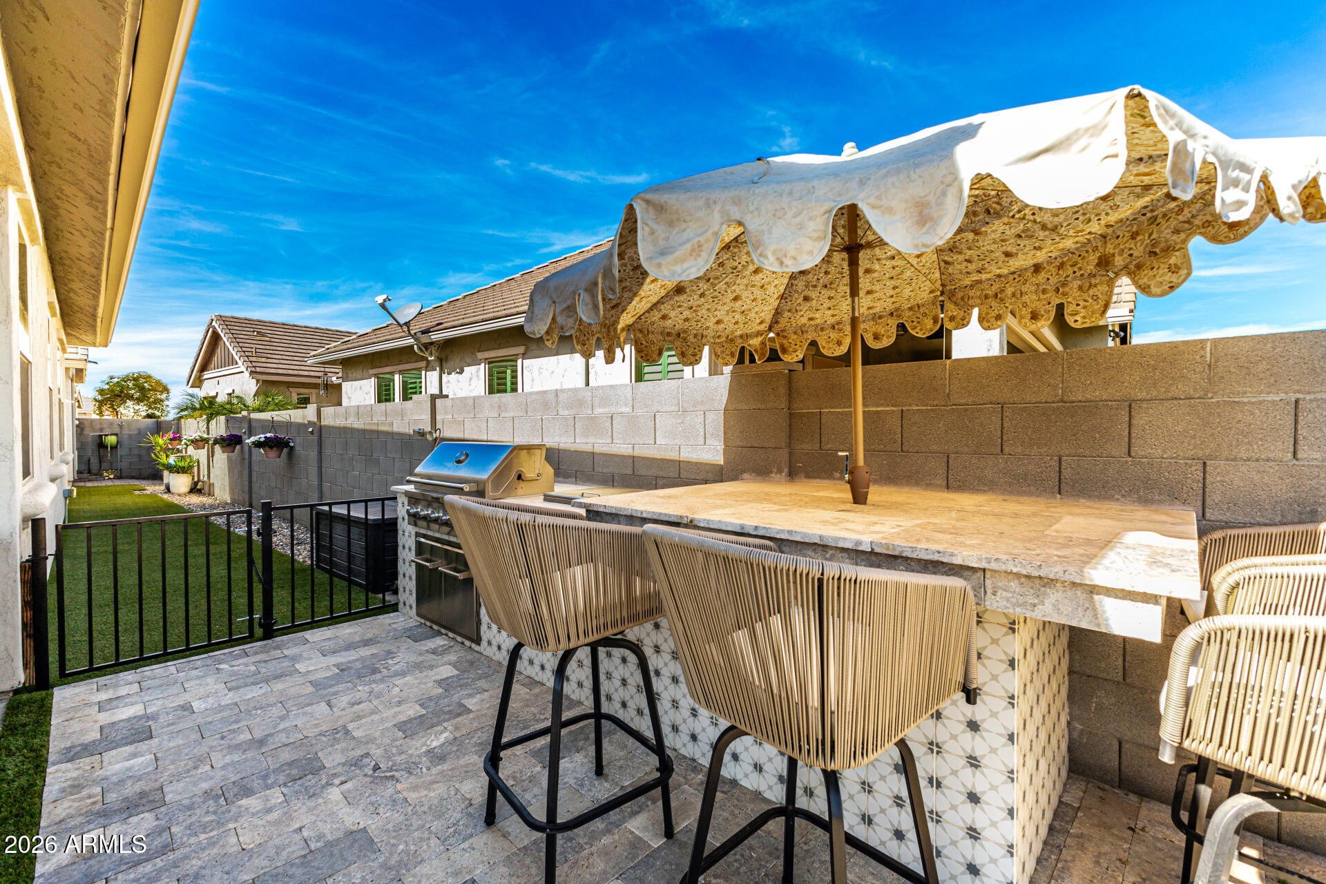 2941 South Jeffry Street Gilbert, AZ 85295 - Photo 36 of 47 a view of a chairs and table in the backyard