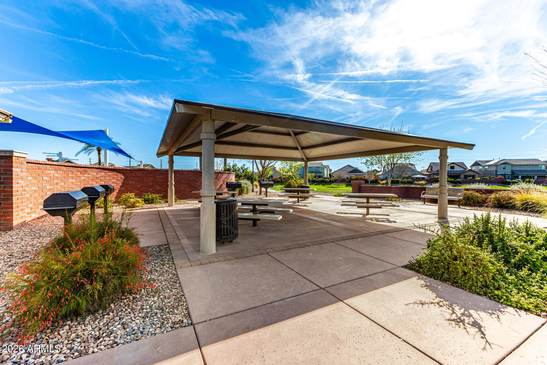 2941 South Jeffry Street Gilbert, AZ 85295 - Photo 41 of 47 a view of a patio with table and chairs under an umbrella