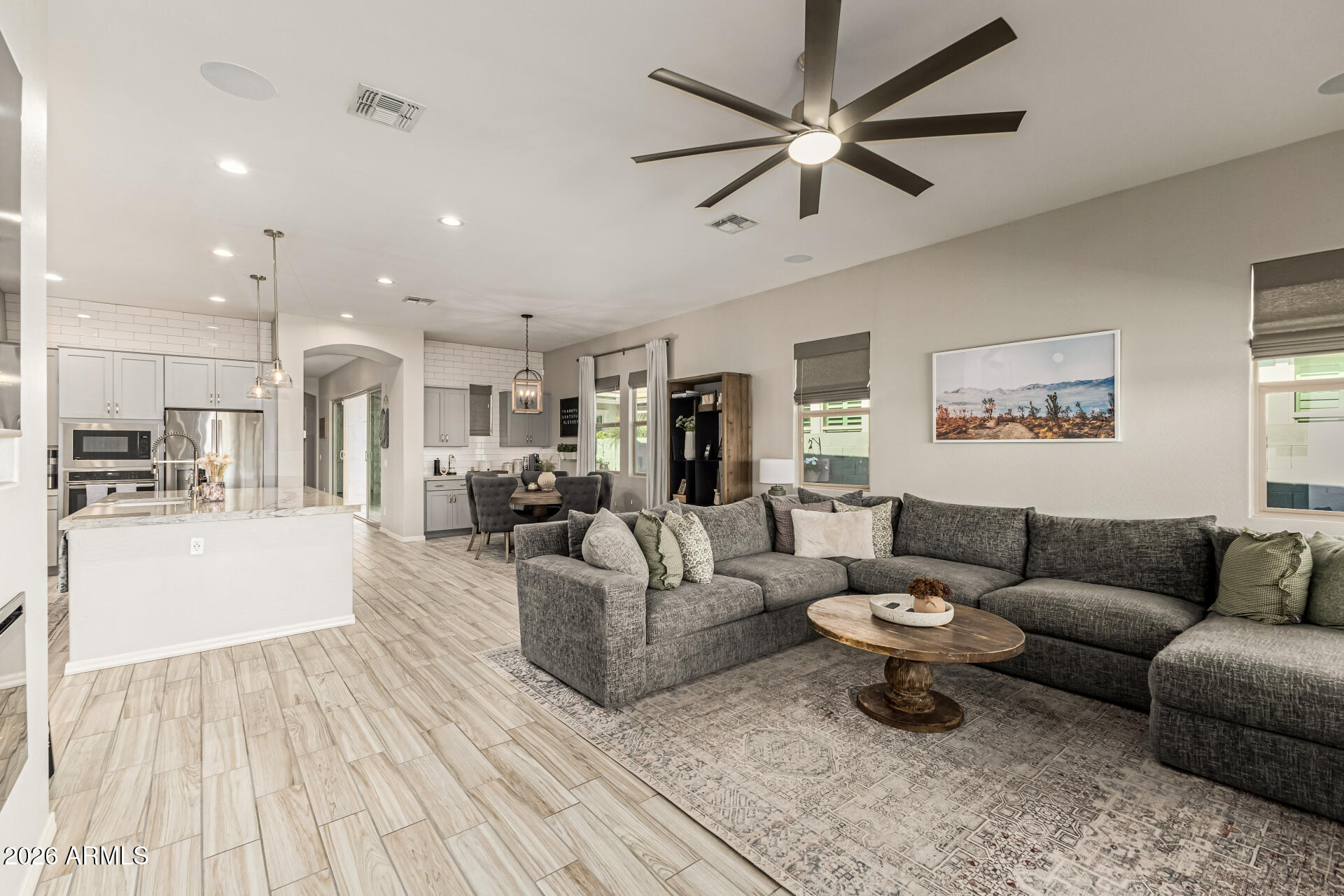 2941 South Jeffry Street Gilbert, AZ 85295 - Photo 9 of 47 a living room with furniture and a view of kitchen