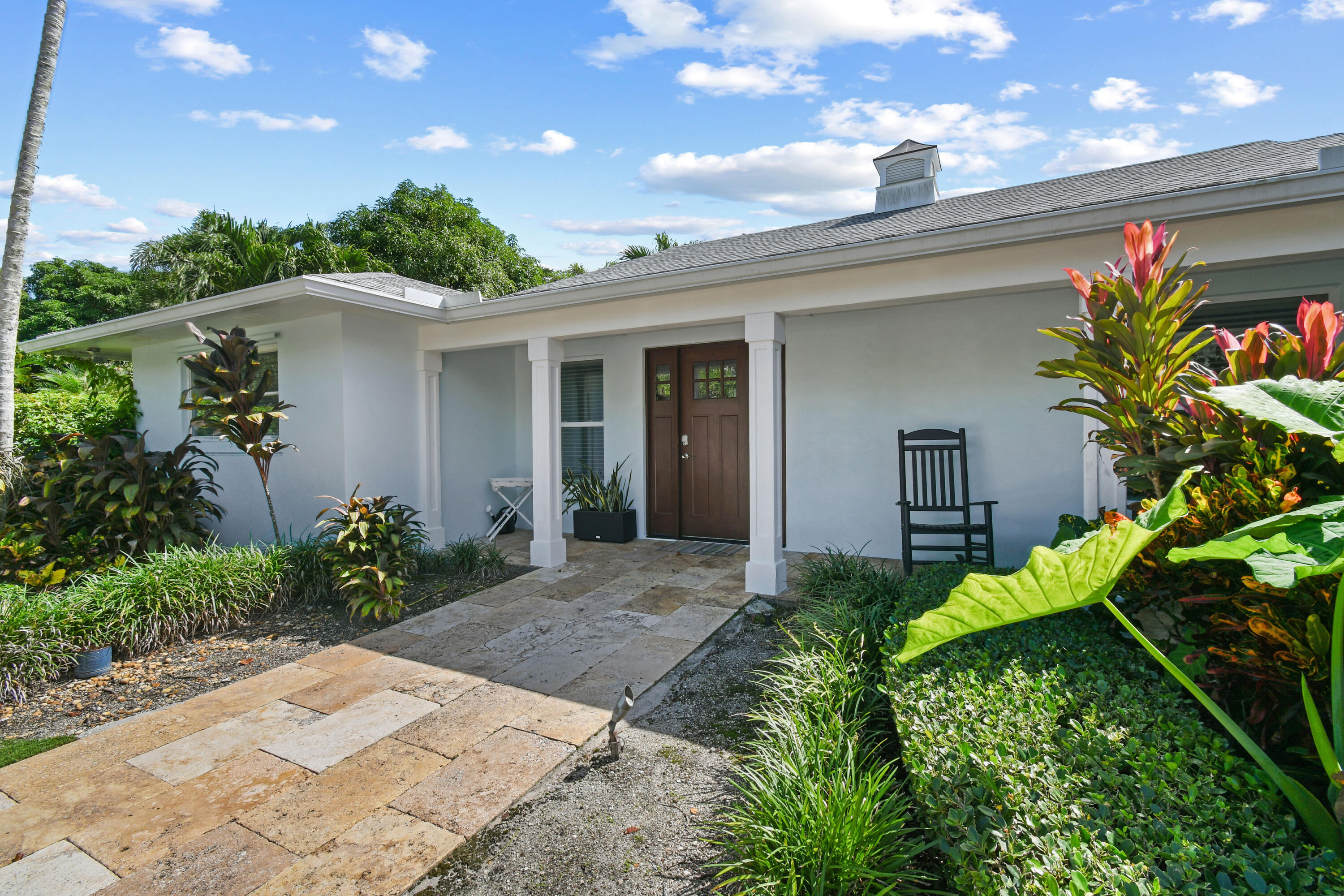 9195 Southeast Cove Point Street Jupiter, FL 33469 - Photo 13 of 28 a view of a backyard with plants