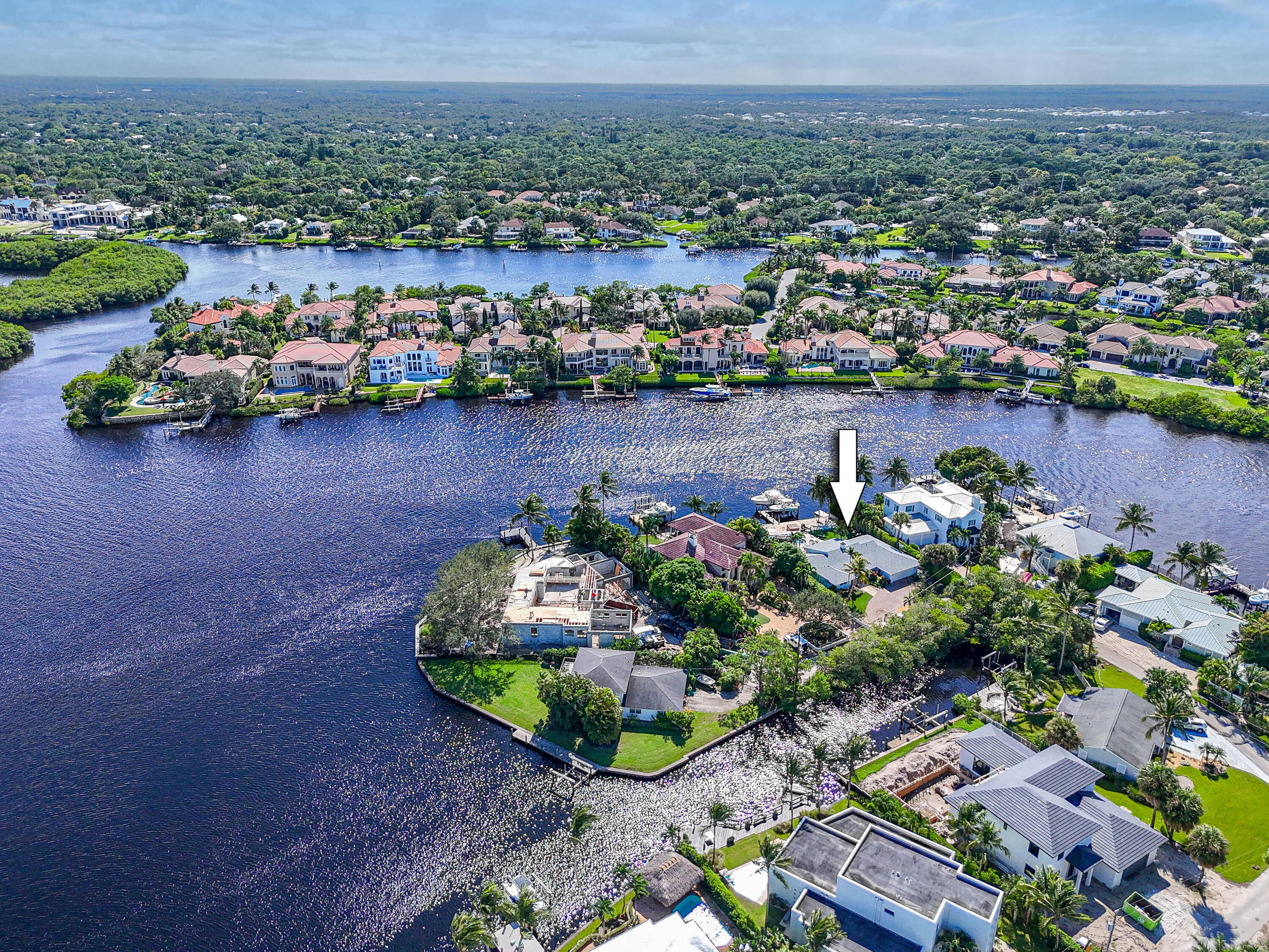 9195 Southeast Cove Point Street Jupiter, FL 33469 - Photo 18 of 28 an aerial view of a house with a lake view