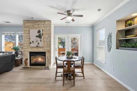 a dining room with furniture and a fireplace