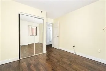 a spacious bathroom with a double vanity sink toilet mirror and shower