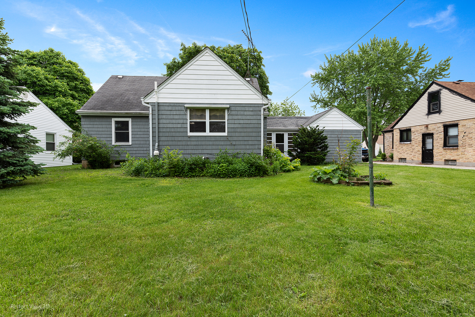 168 South Alfred Avenue Elgin, IL 60123 - Photo 2 of 15 a view of a house with a yard and sitting area