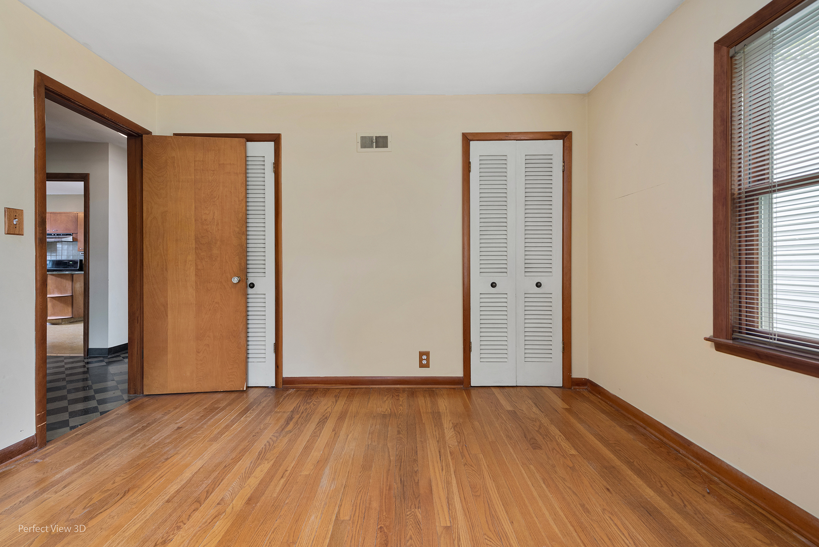 168 South Alfred Avenue Elgin, IL 60123 - Photo 5 of 15 an empty room with wooden floor and windows