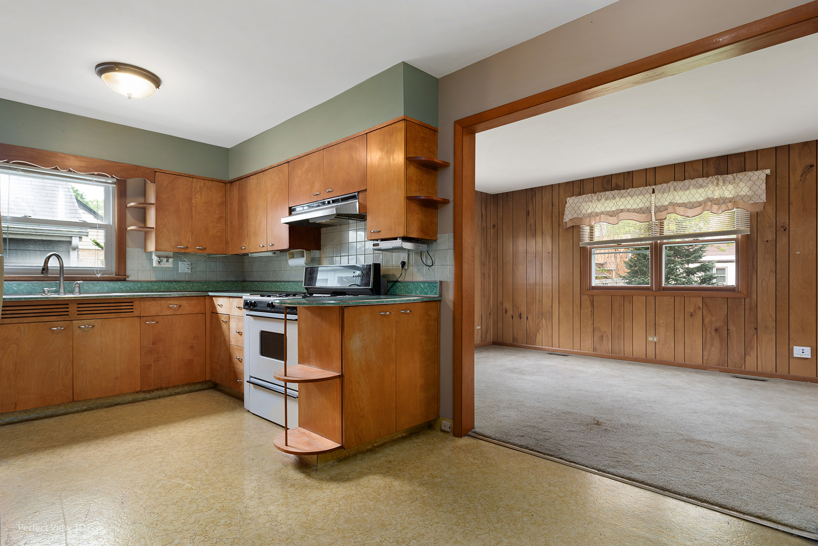168 South Alfred Avenue Elgin, IL 60123 - Photo 8 of 15 a kitchen with stainless steel appliances granite countertop a stove a sink and a refrigerator