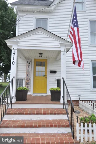 a view of a brick house with large windows