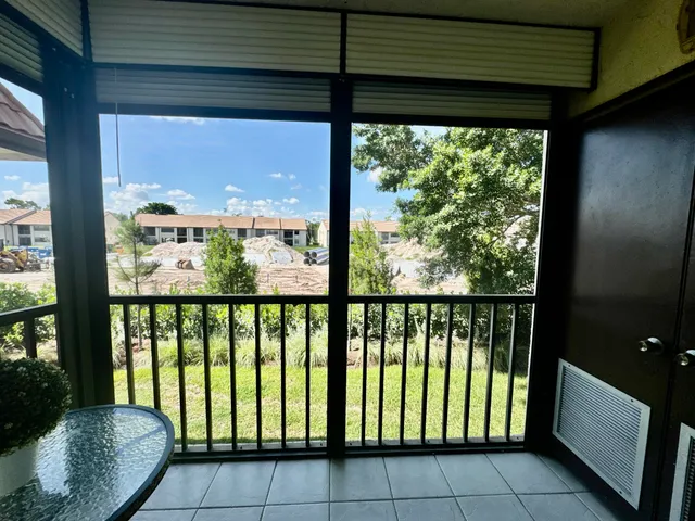 a view of a glass door with a balcony