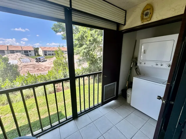 a view of a glass door with a balcony