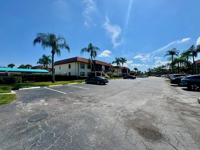 a view of street with parked cars