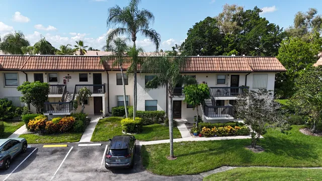 a view of a house with sitting area and garden