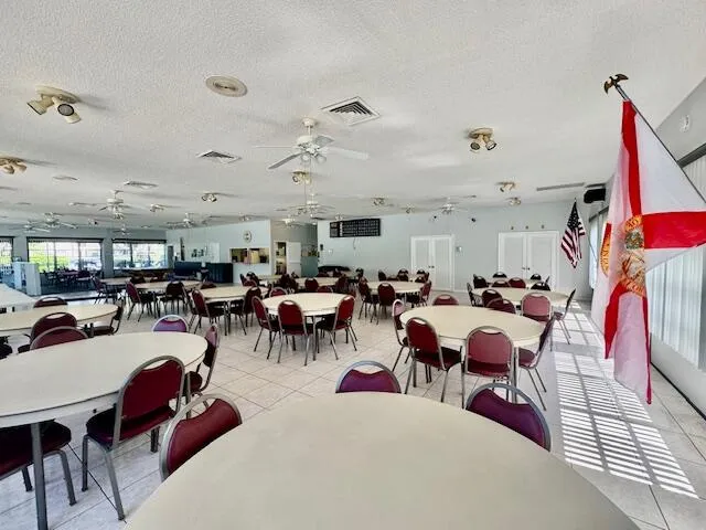 a living room with lots of furniture and a view of bedroom
