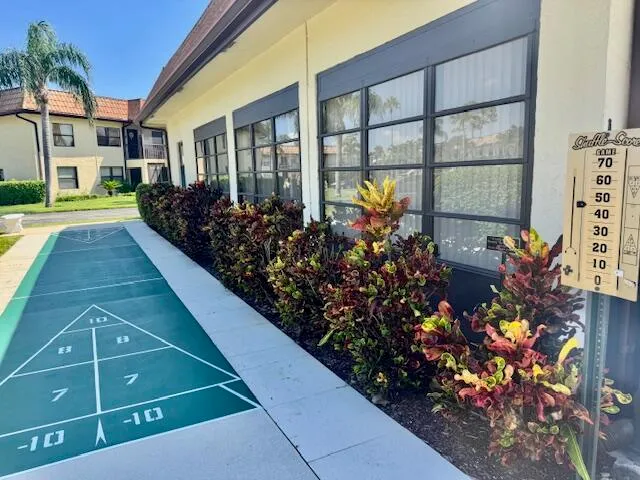 a view of a house with a flower garden