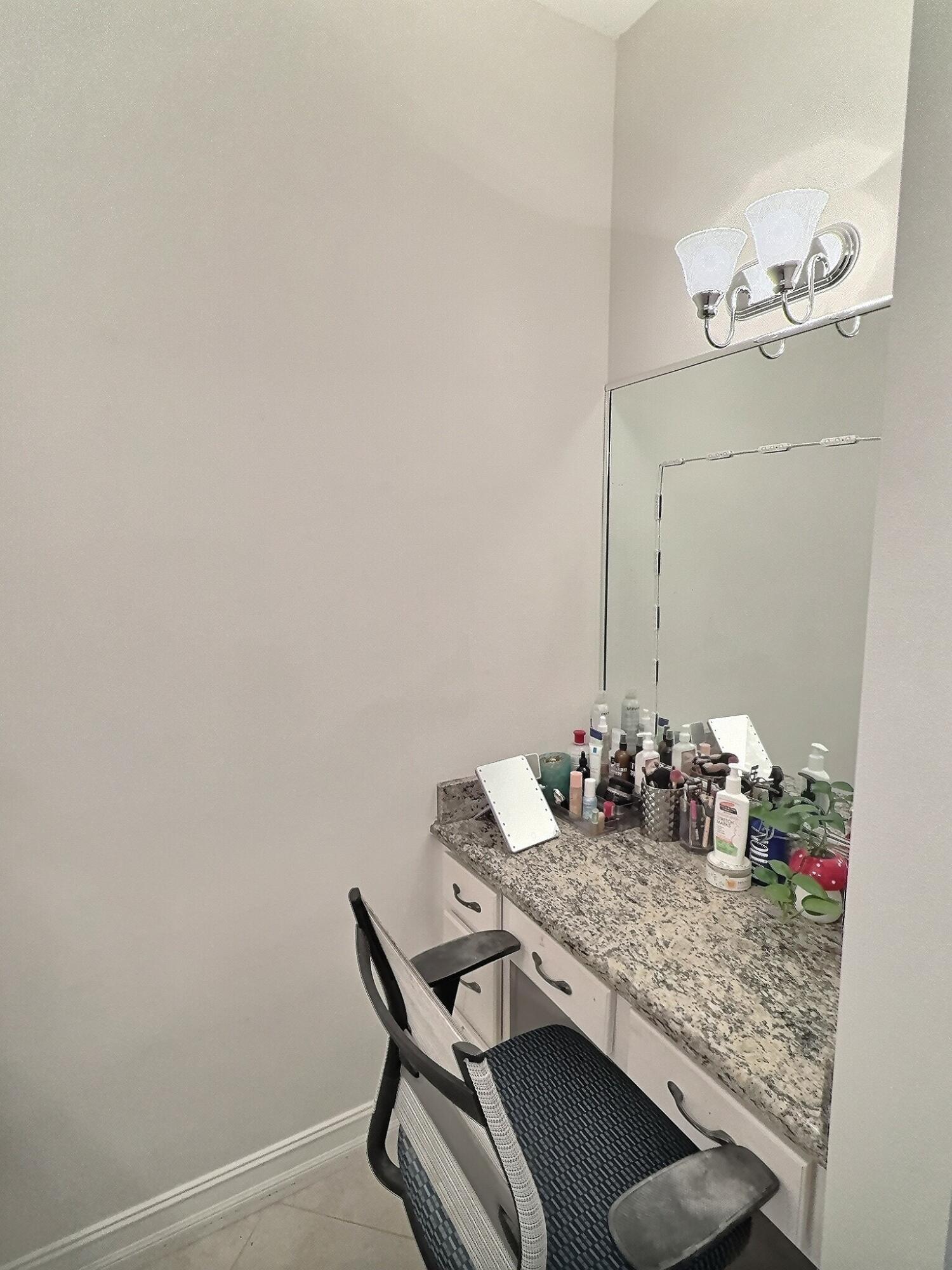 10320 Southwest Stephanie Way, Unit 7210 Port St. Lucie, FL 34987 - Photo 13 of 15 a dining room with table and chairs